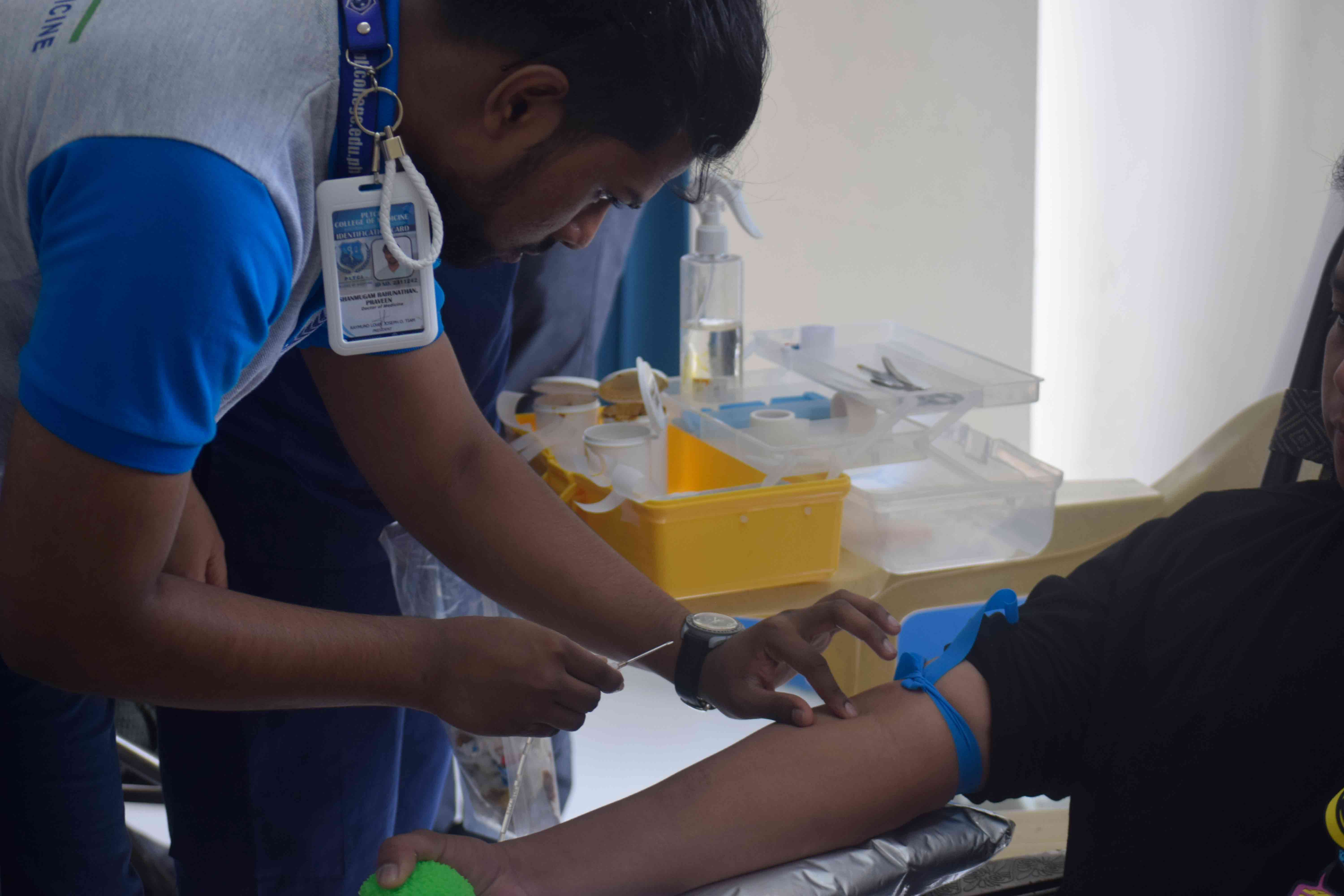Students performing assays and clinical pathology diagnostics in the lab